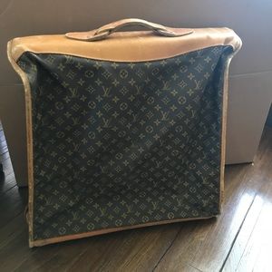 Louis Vuitton garment bag.
